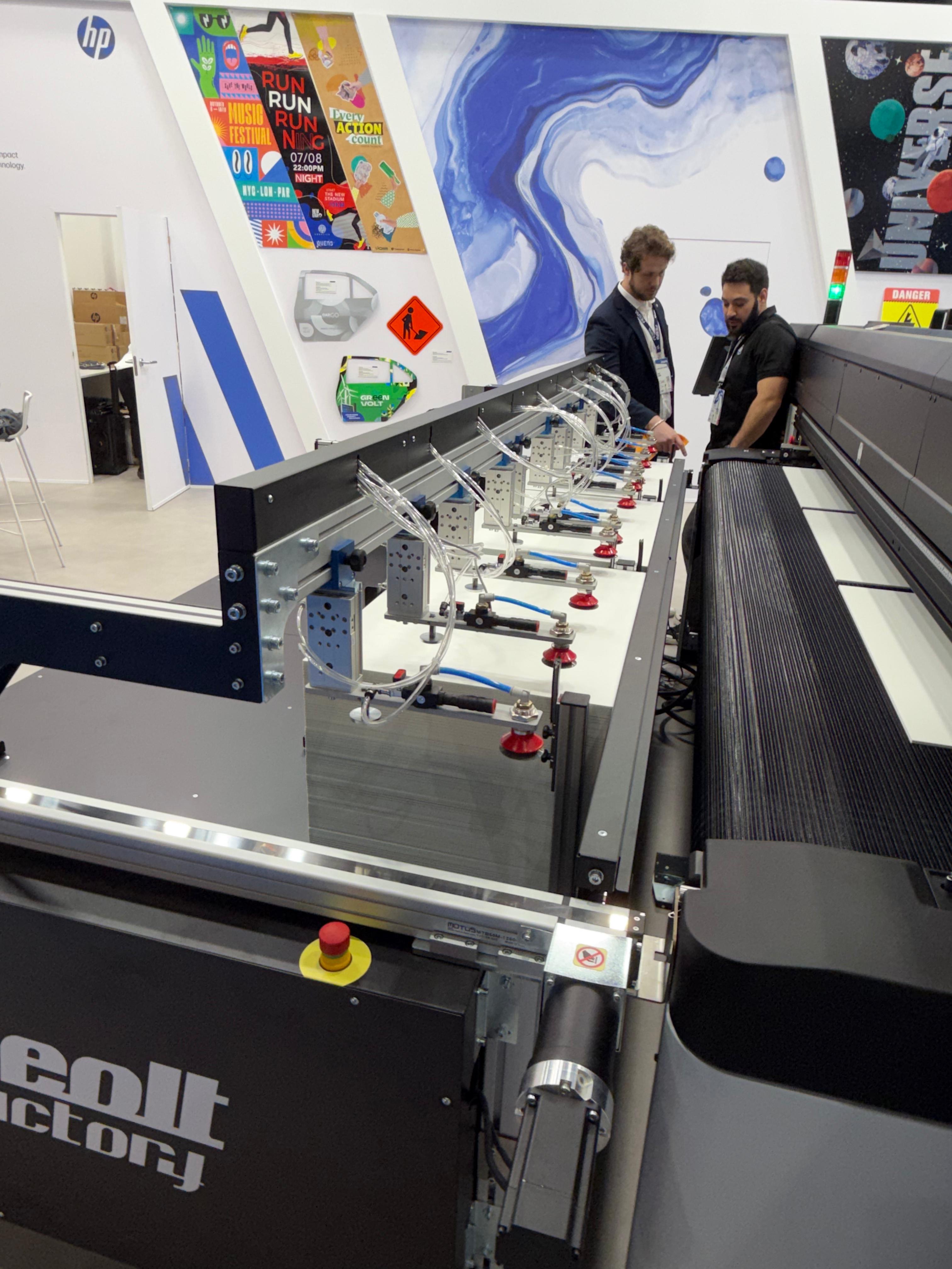 HP Latex R2000 industrial printer integrated with Neolt Factory conveyor and stacker at FESPA 2026