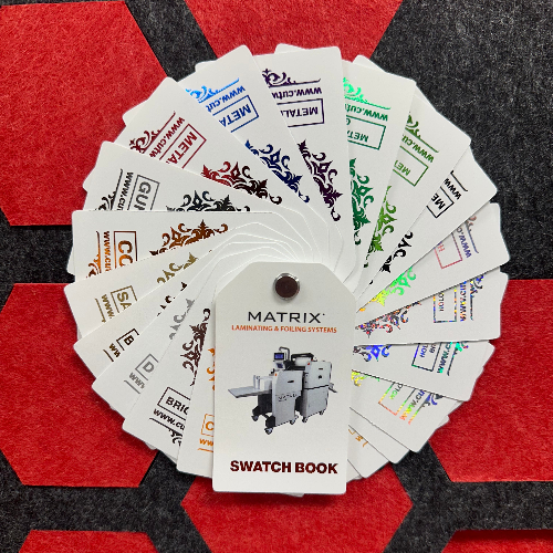 A professional display of GWF foil swatches featuring a variety of metallic finishes. The samples include vibrant shades of gold, silver, holographic, and multi-colored foils arranged in a fan-like or grid pattern, showcasing the reflective texture and high-shine quality of the foil stamping materials.